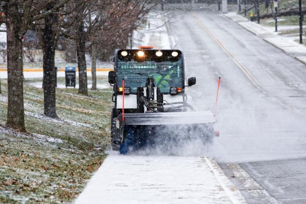 Picture of vehicle removing snow from sidewalk