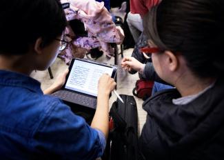 Students reading music off an iPad