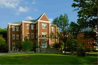 Outside of Miller Hall through trees