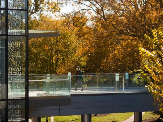 Photo of student walking into student center