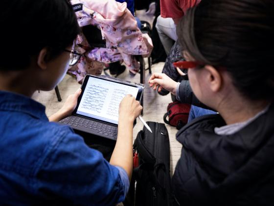 Students reading music off an iPad