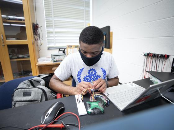 Electrical engineering student at work