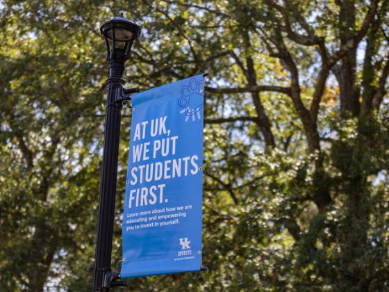 a sign on campus that says "At UK, we put students first"